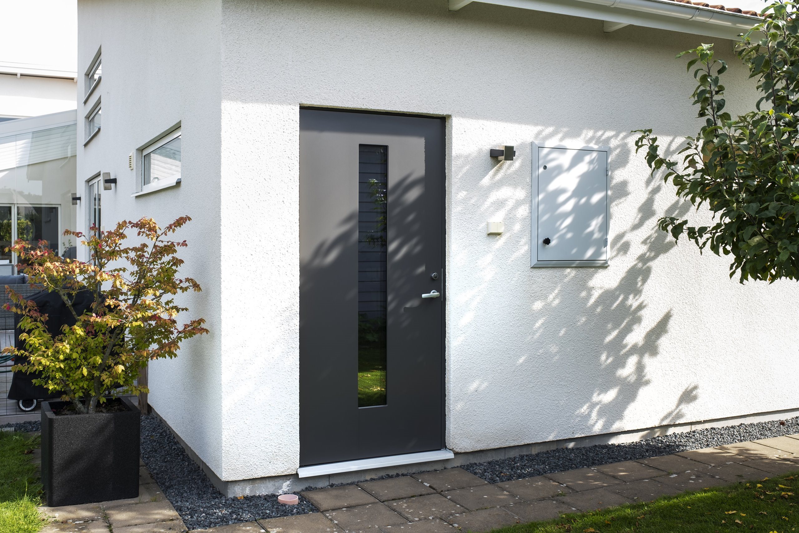 JW-Exterior-Door-TOWER-ECO-Gray-in-white-stone-house